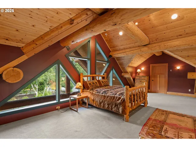 a bed room with a bed and a window