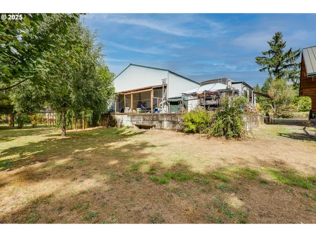 an aerial view of a house with outdoor space