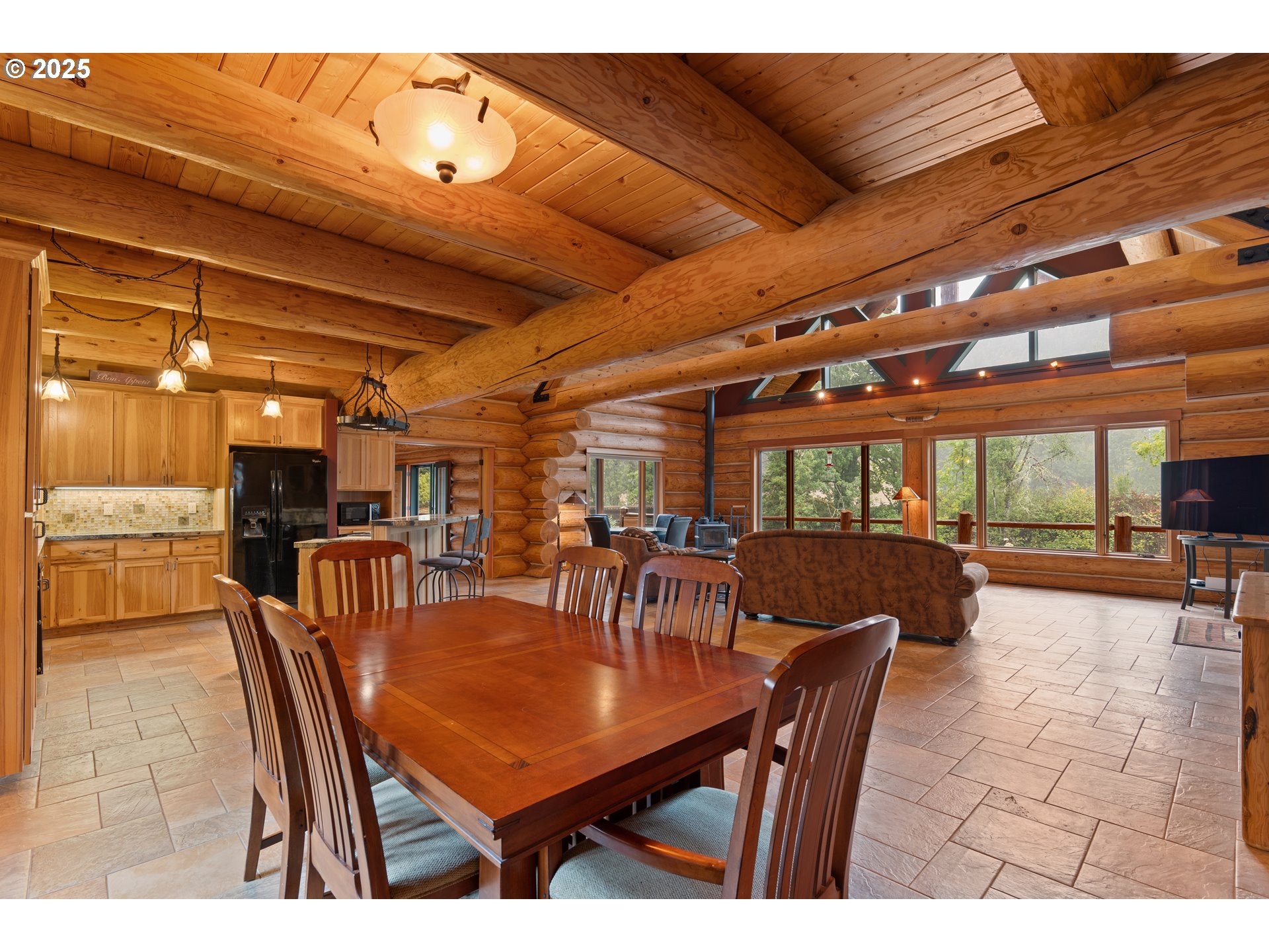 39582 Little Fall Creek Road Fall Creek, OR 97438 - Photo 8 of 44 a view of a dining room with furniture and a chandelier
