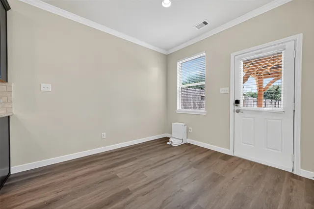 a view of kitchen view wooden floor and electronic appliances