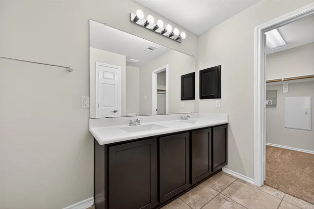 a bathroom with a tub and a shower