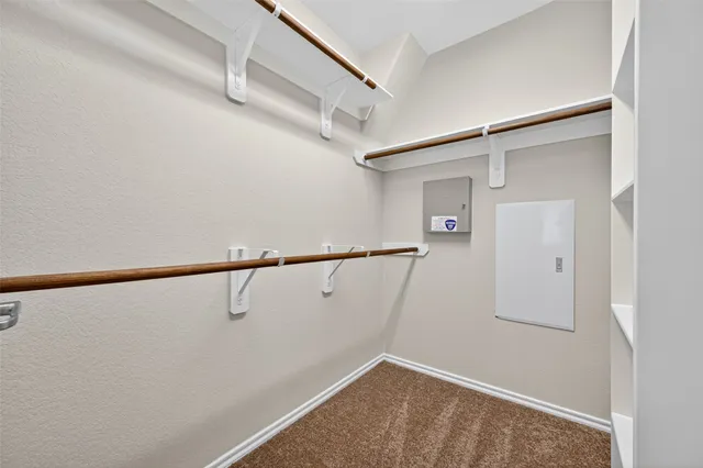 a view of a backyard with wooden fence