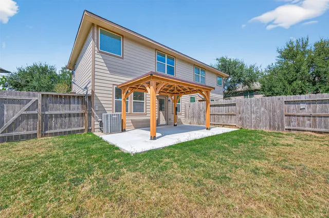 a view of a swimming pool with a yard
