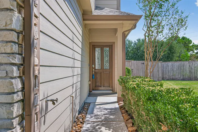 a view of hallway with wooden floor and staircase