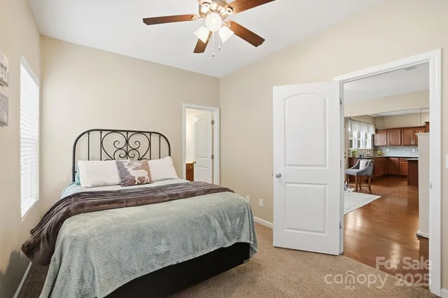 a bedroom with a bed and a view of walk in closet
