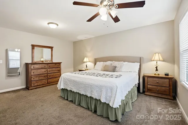 a bedroom with a bed and dresser