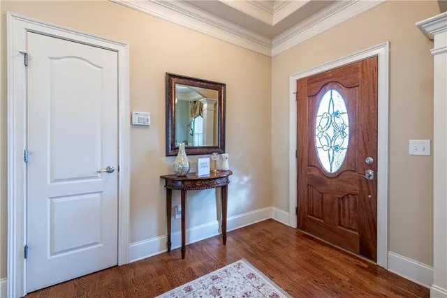 a view of an entryway with wooden floor