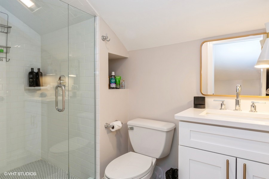 3205 Sprucewood Road Wilmette, IL 60091 - Photo 11 of 15 a bathroom with a toilet sink and shower