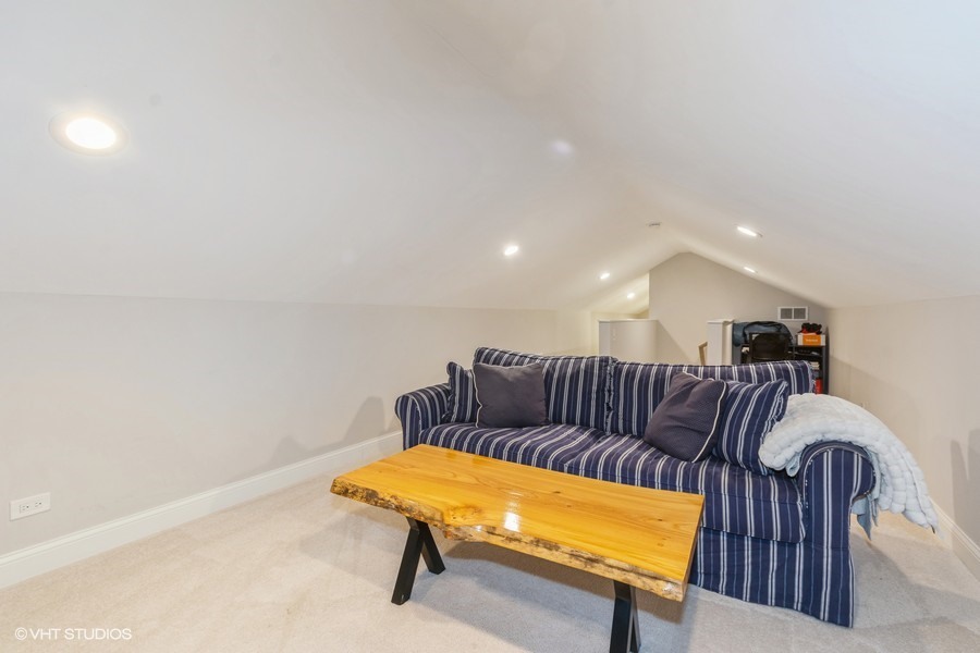 3205 Sprucewood Road Wilmette, IL 60091 - Photo 12 of 15 a large white couch sitting in a kitchen