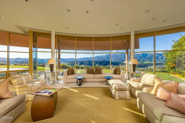 a dining room with furniture window and outside view