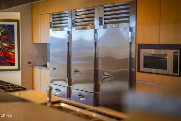 a kitchen with counter top space and appliances