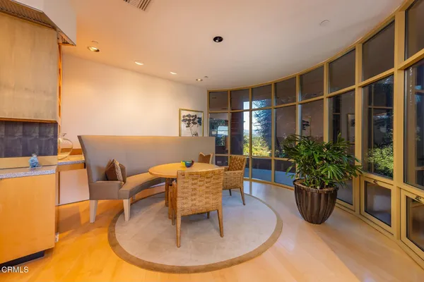 a spacious bedroom with a bed and a large window