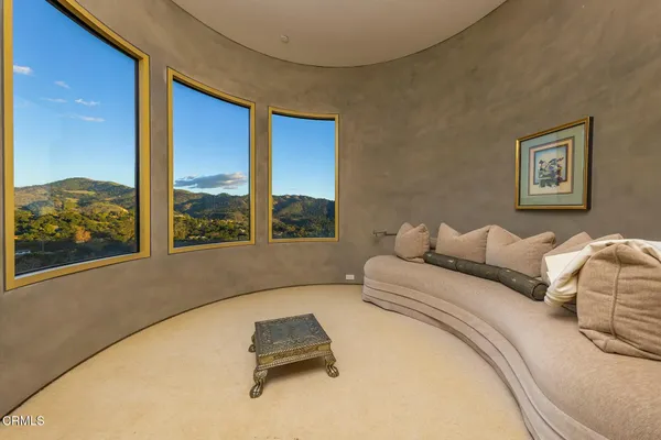 a bedroom with a bed and a view of closet