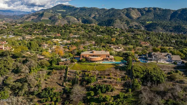 a front view of house with yard and outdoor seating