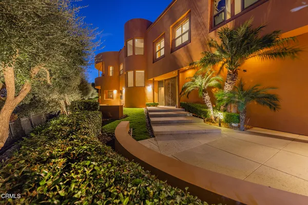 a view of a swimming pool with an outdoor seating and a yard