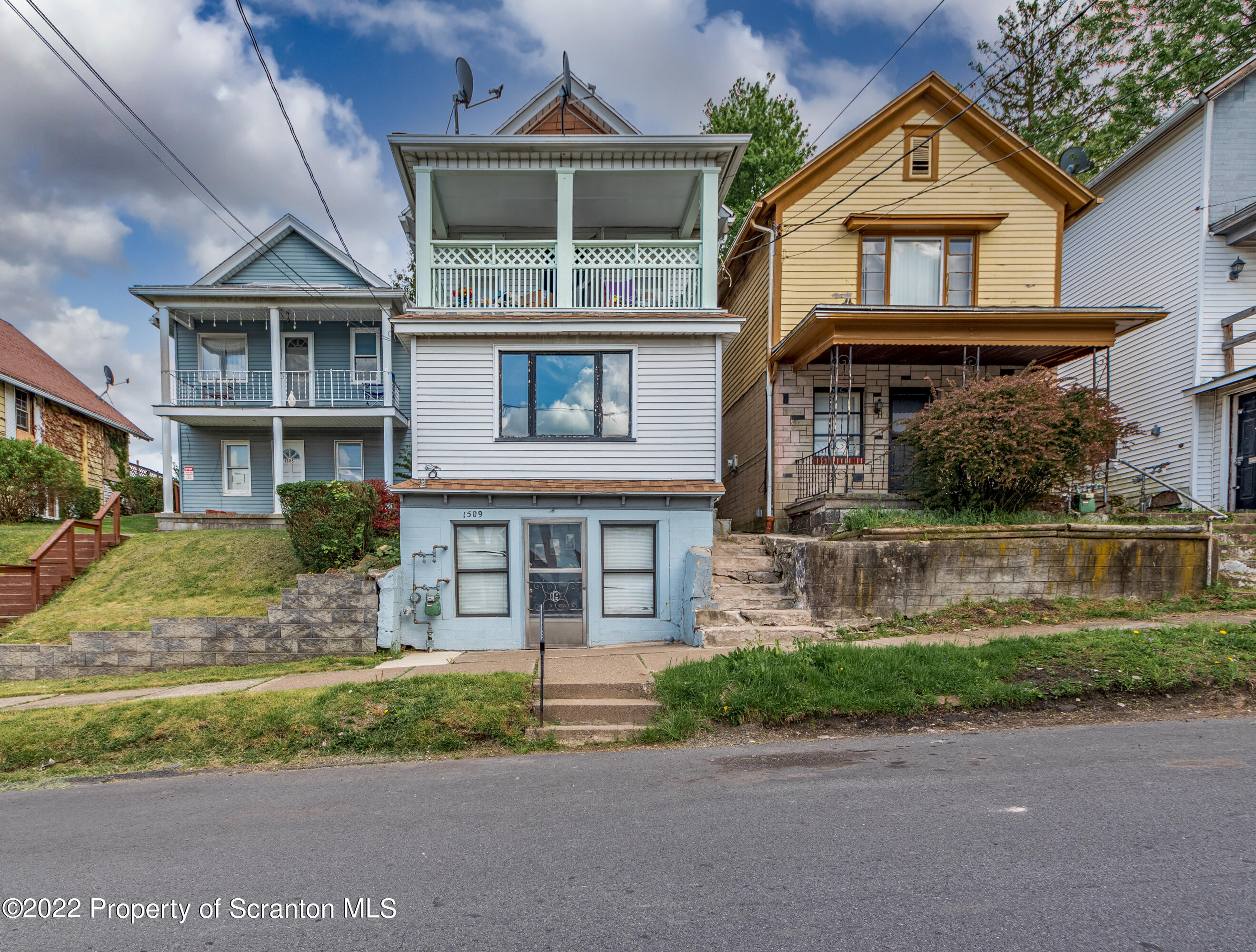 1509 Prospect Avenue Scranton, PA 18505 - Photo 1 of 28 a front view of a house with a yard and garage
