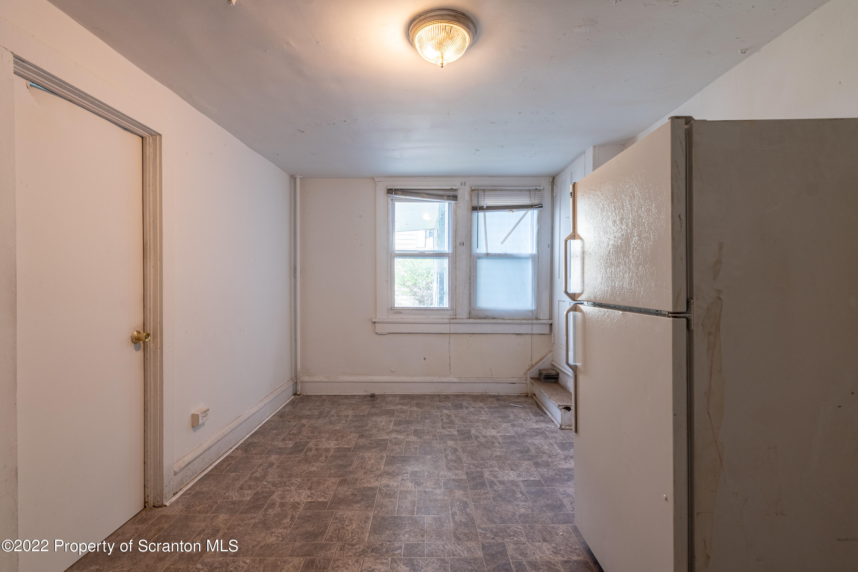 1509 Prospect Avenue Scranton, PA 18505 - Photo 19 of 28 a view of an empty room with a window