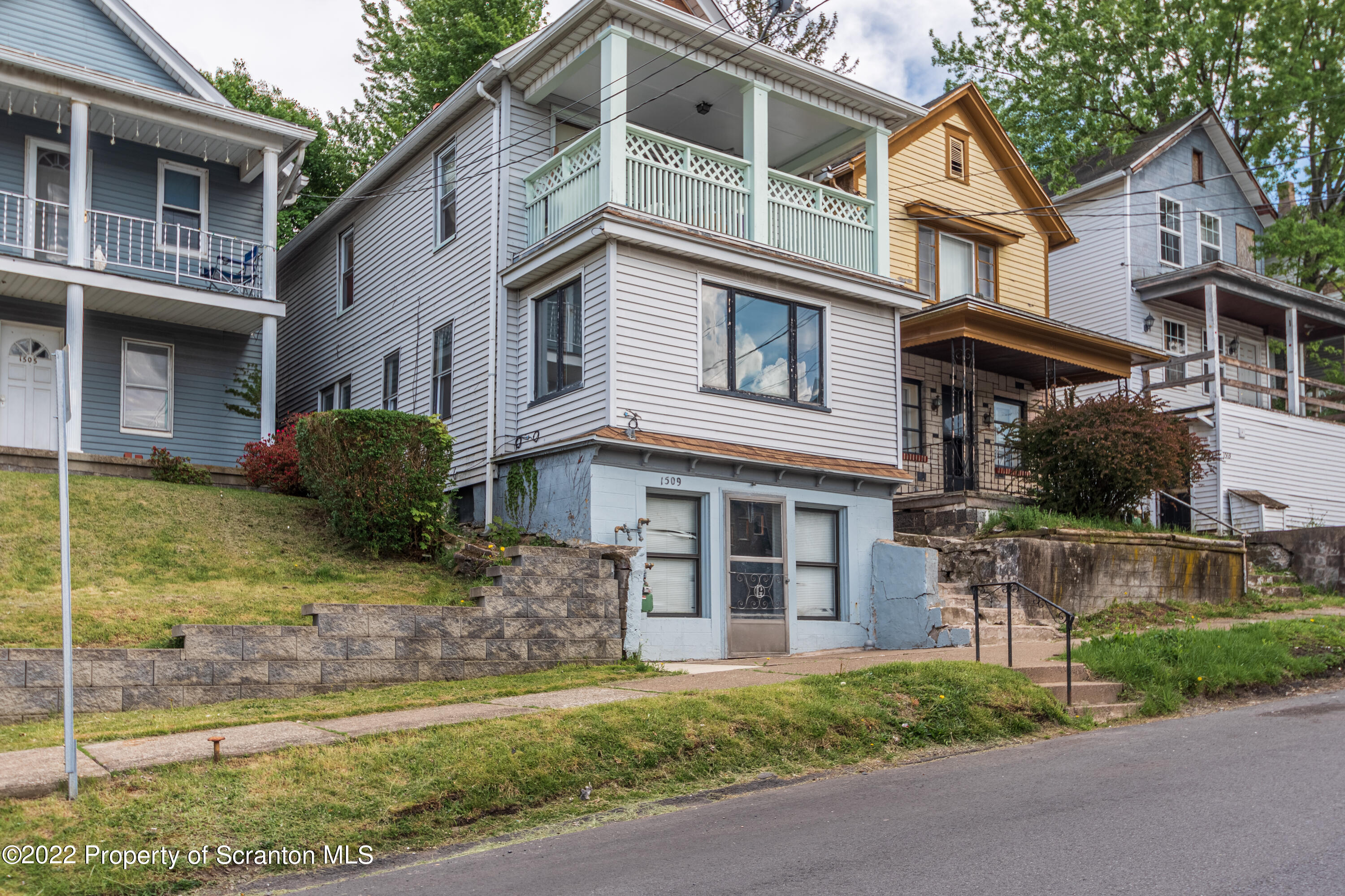 1509 Prospect Avenue Scranton, PA 18505 - Photo 2 of 28 a front view of a house with garden