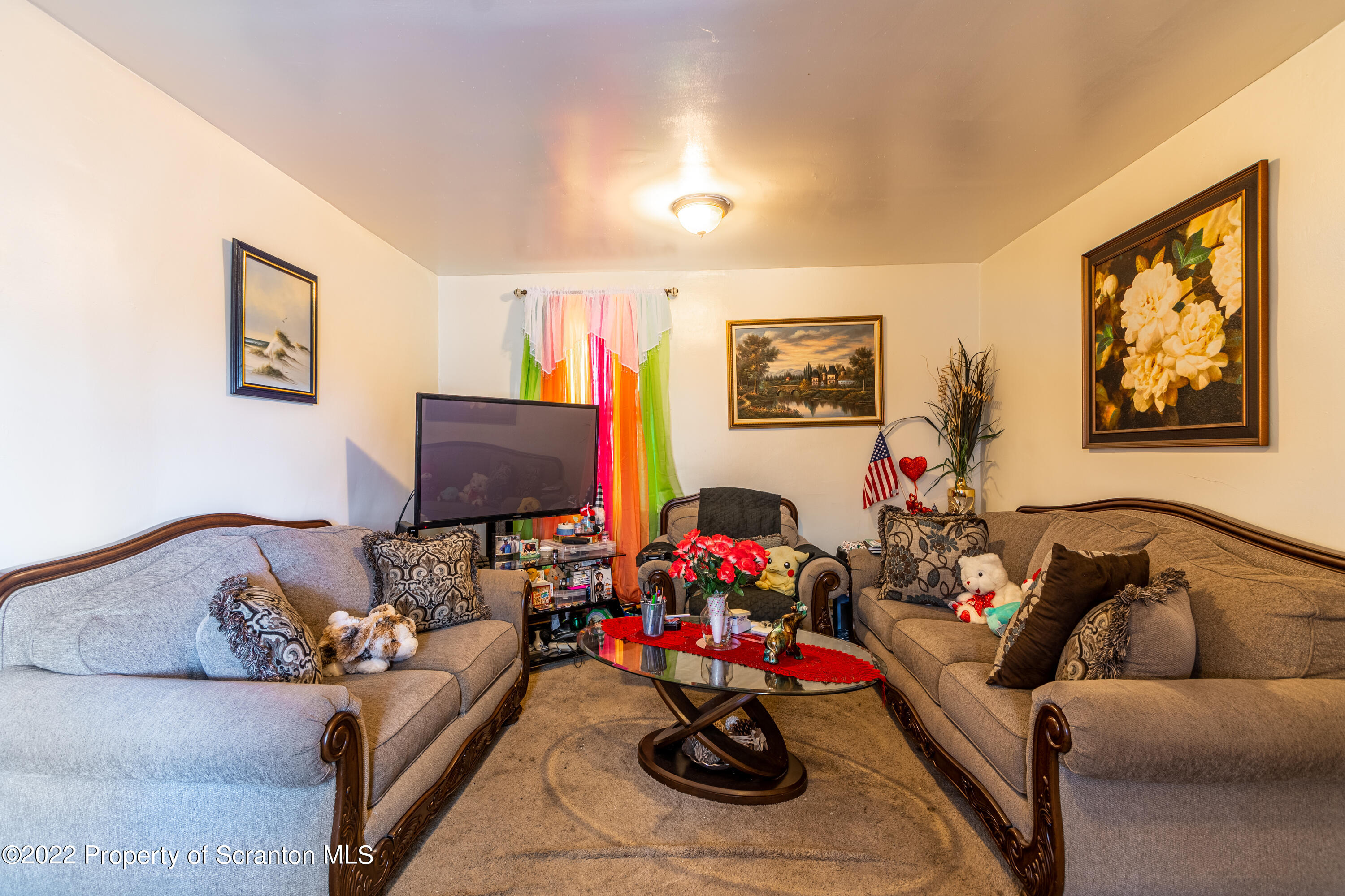 1509 Prospect Avenue Scranton, PA 18505 - Photo 22 of 28 a living room with furniture and flowers
