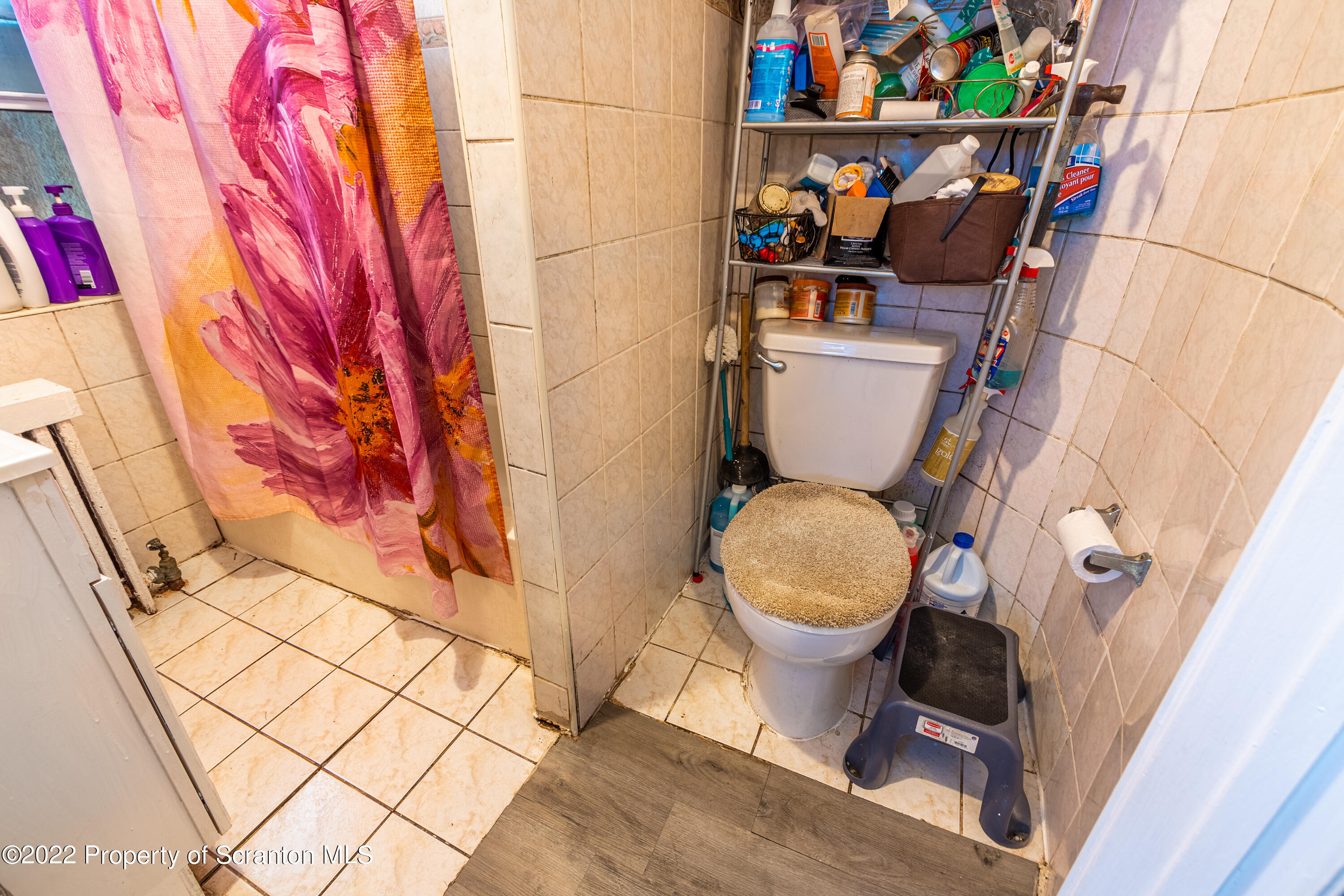 1509 Prospect Avenue Scranton, PA 18505 - Photo 26 of 28 a bathroom with a toilet and a shower curtain