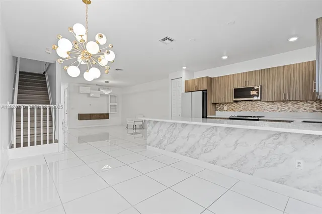 a white toilet sitting next to a white wall