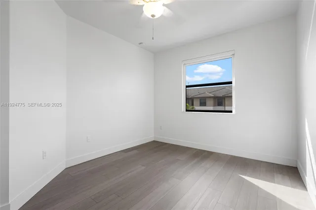 a room with a bench and a wooden floor