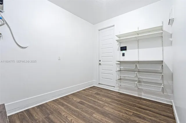 a backyard of a house with palm tree