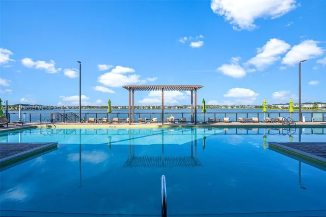 a view of a swimming pool with a lounge chairs
