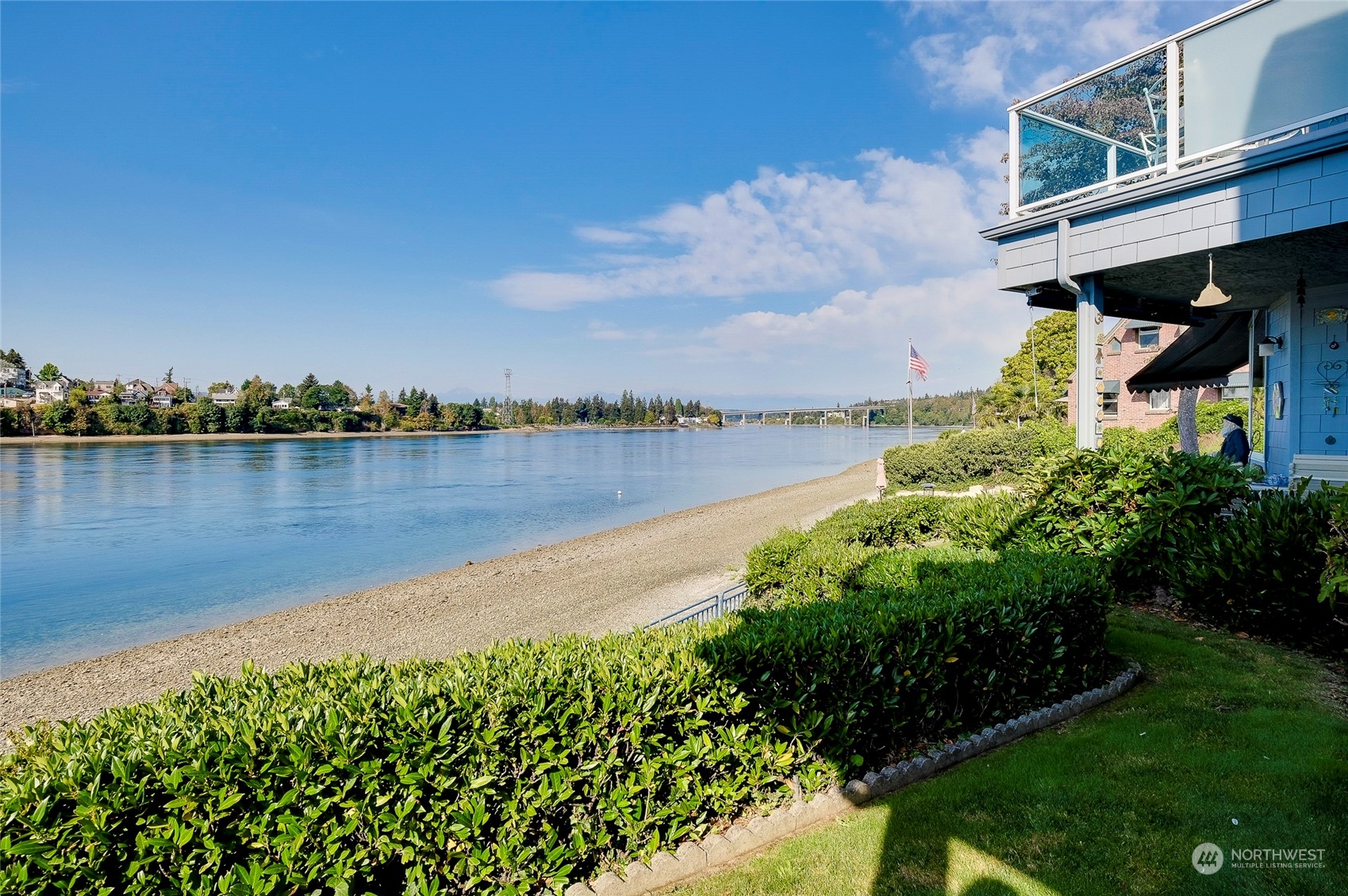 1135 Wheaton Way, Unit B3 Bremerton, WA 98310 - Photo 12 of 17 a view of a lake with a house in the background