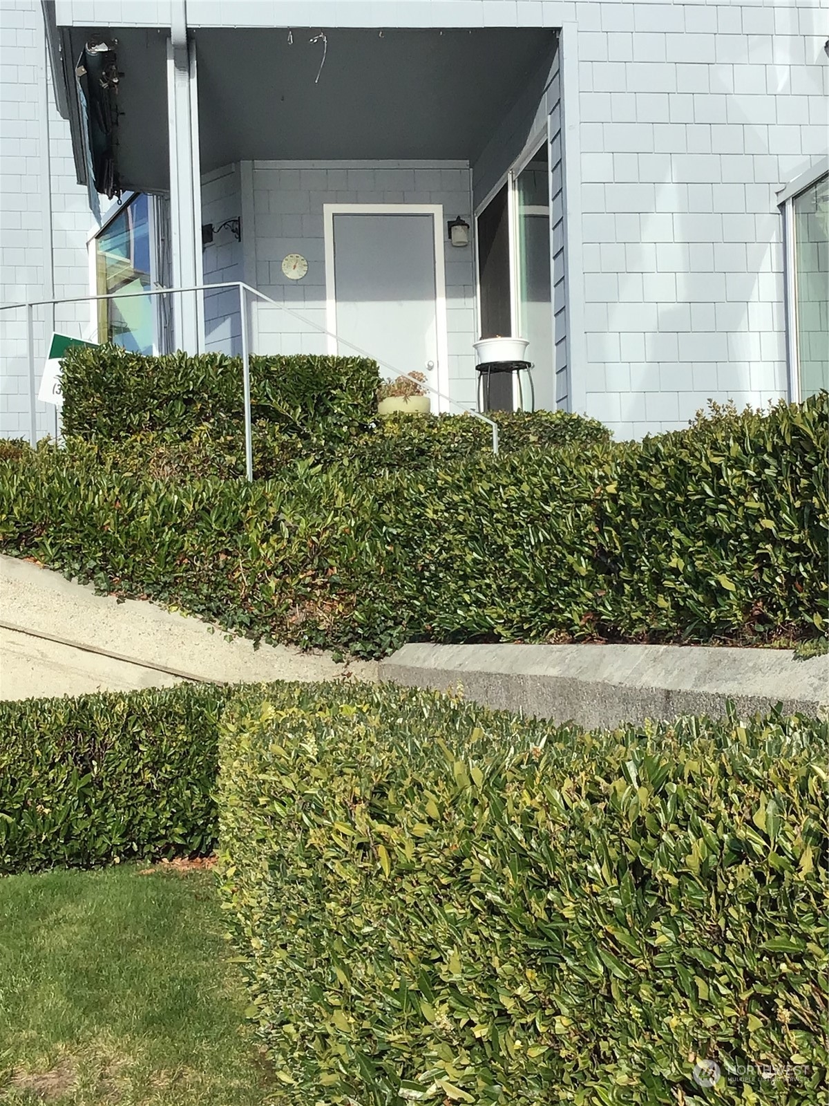 1135 Wheaton Way, Unit B3 Bremerton, WA 98310 - Photo 14 of 17 a view of a house with a yard