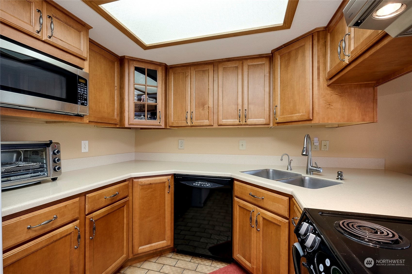 1135 Wheaton Way, Unit B3 Bremerton, WA 98310 - Photo 5 of 17 a kitchen with stainless steel appliances granite countertop a sink and a stove