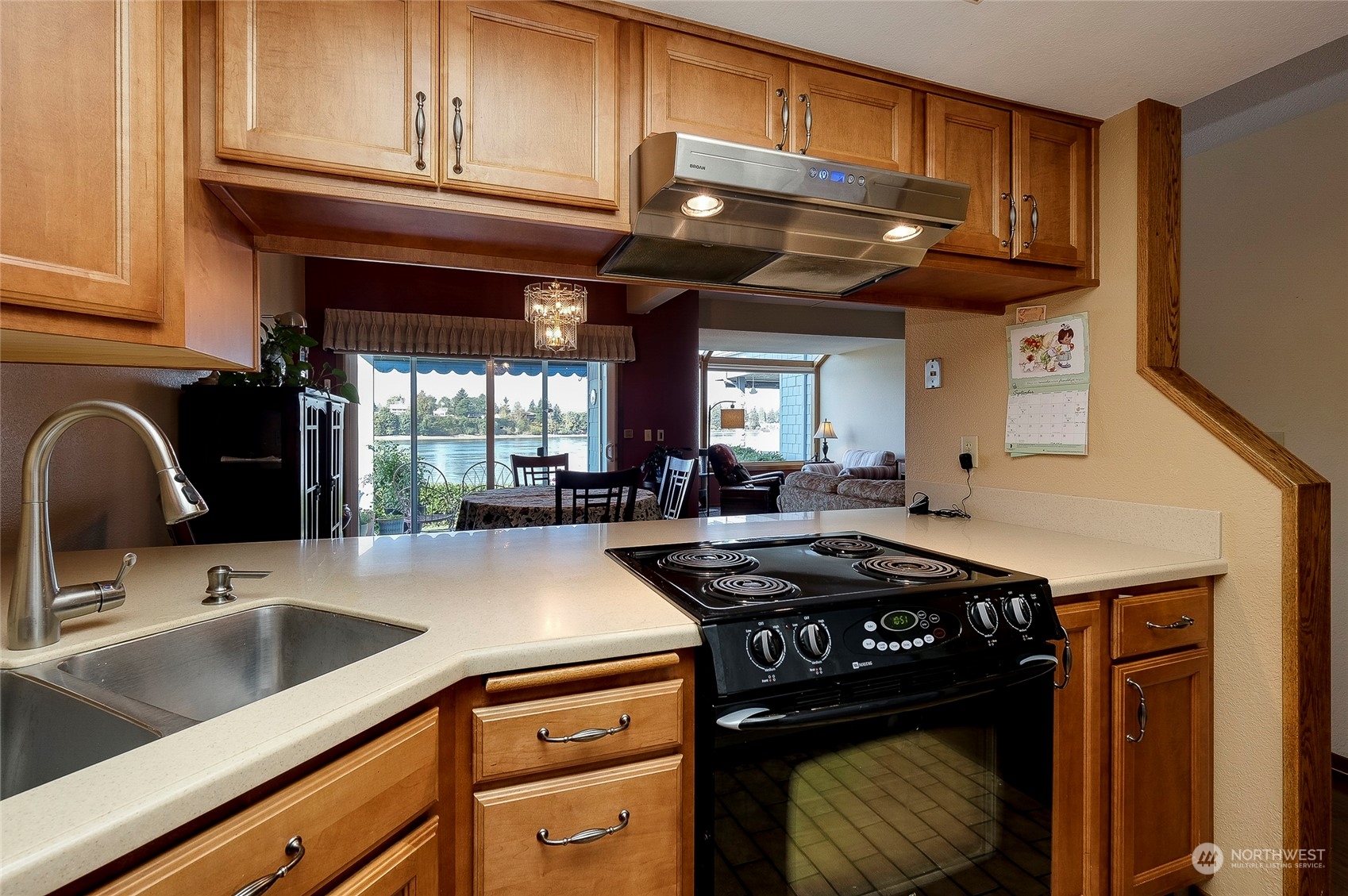 1135 Wheaton Way, Unit B3 Bremerton, WA 98310 - Photo 6 of 17 a kitchen with stainless steel appliances granite countertop a sink a stove and cabinets