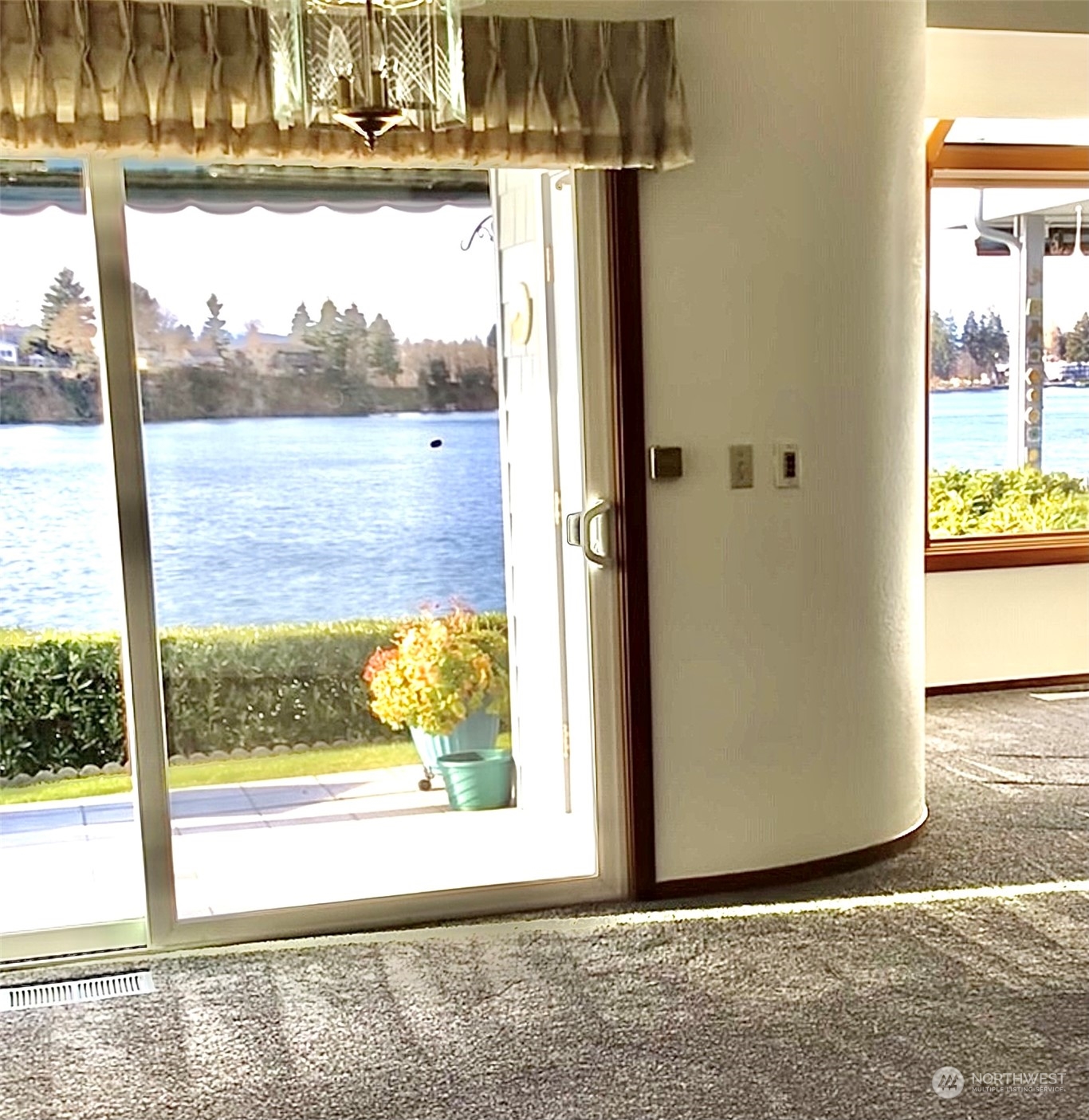 1135 Wheaton Way, Unit B3 Bremerton, WA 98310 - Photo 8 of 17 a view of a room with wooden floor and a floor to ceiling window