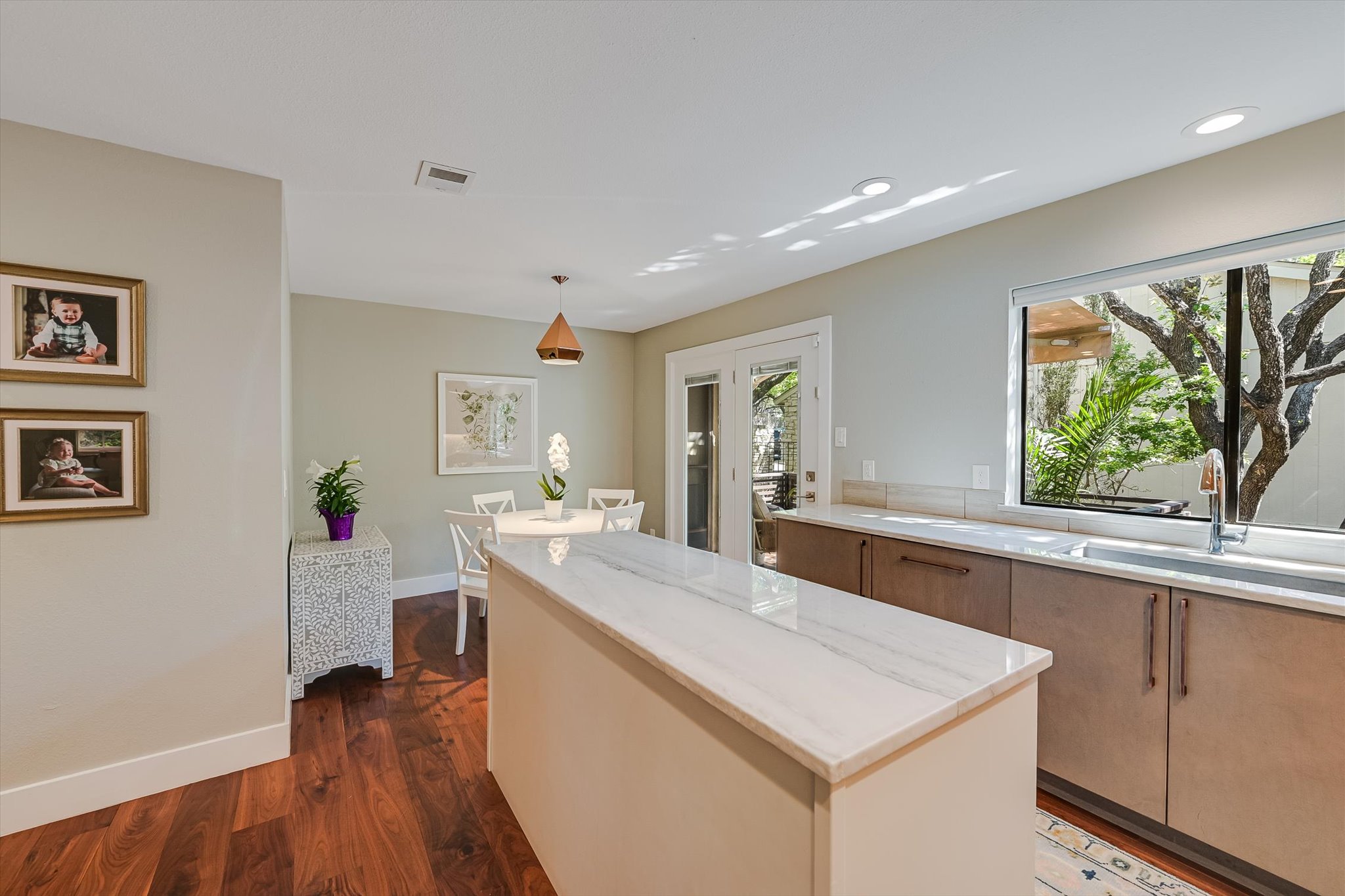 8121 Raintree Place Austin, TX 78759 - Photo 3 of 26 Natural light throughtout the kitchen