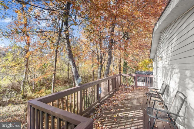 a view of two chairs on the roof deck