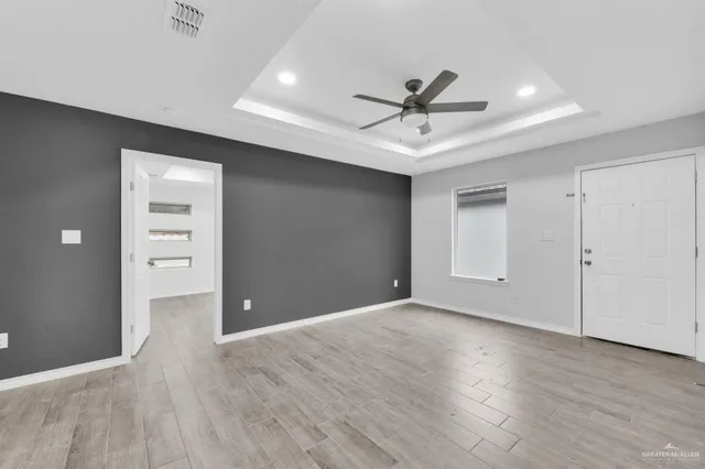 a view of a kitchen with a sink stainless steel appliances and cabinets