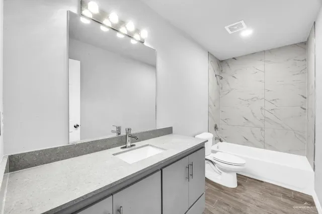 an empty room with a window and a ceiling fan