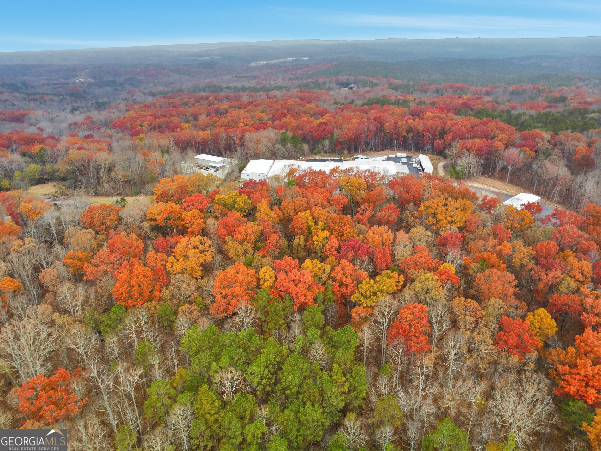 0 Hogan Pond Road Ball Ground, GA 30107 - Photo 2 of 7 a view of city and mountain