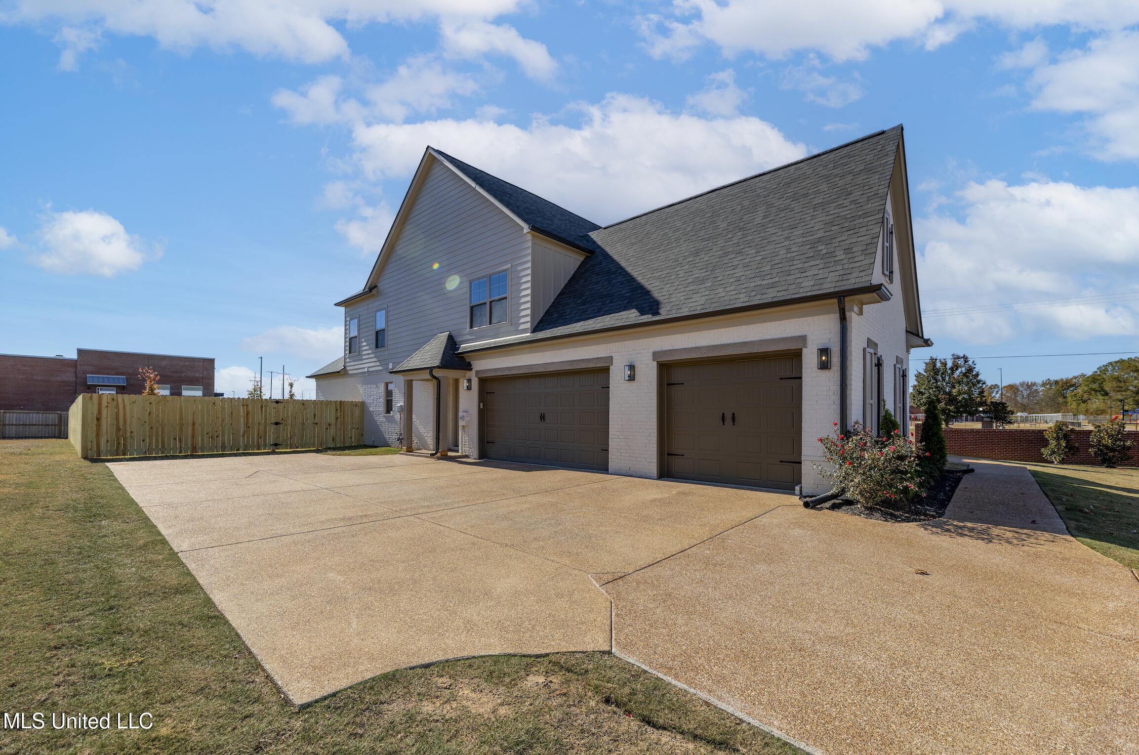 7019 Scarlett Street Olive Branch, MS 38654 - Photo 2 of 32 Triple Garage and Friend's Entry