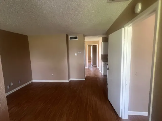 a view of a livingroom with wooden floor
