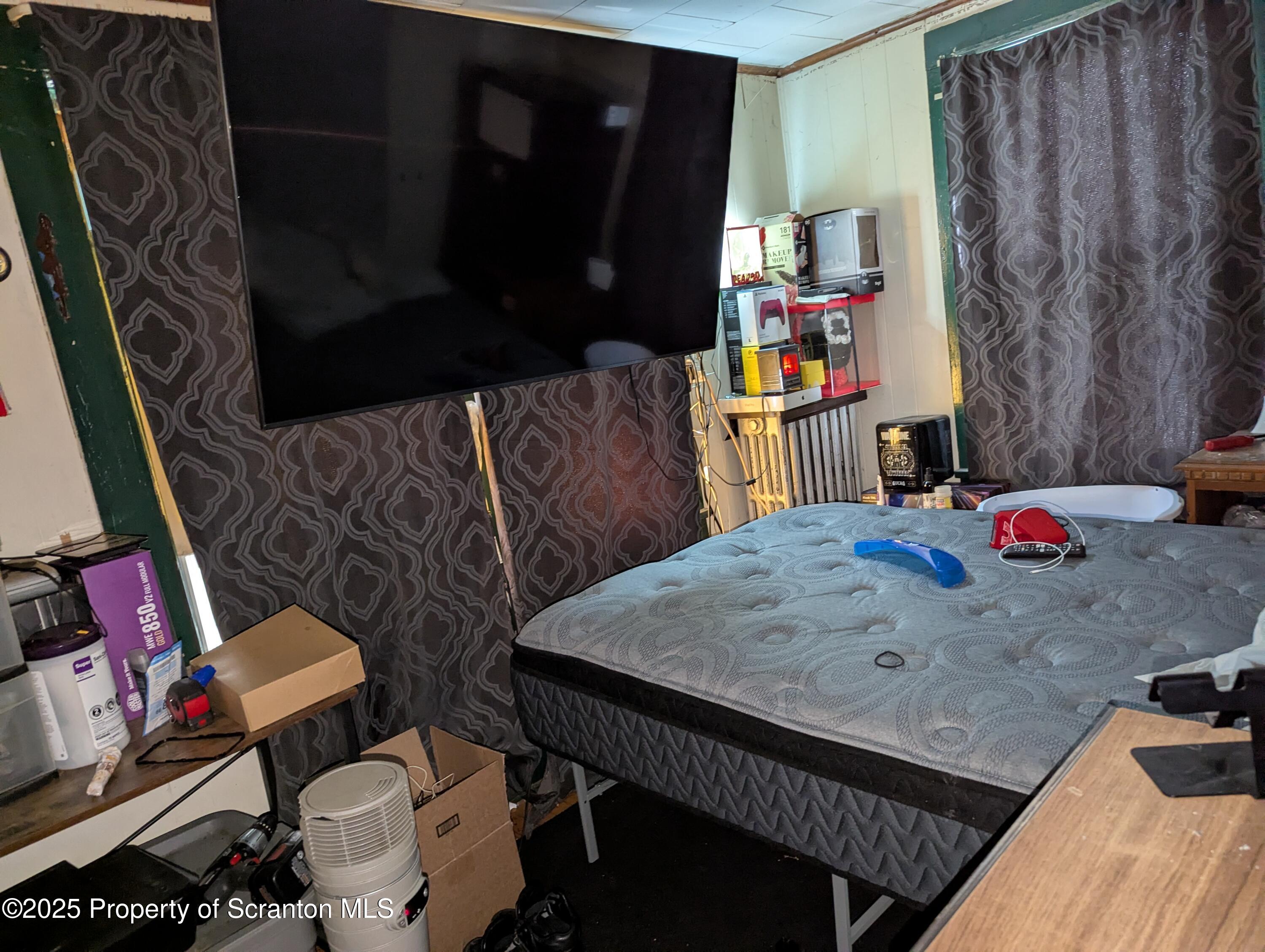 846 Capouse Avenue Scranton, PA 18509 - Photo 12 of 35 a living room with furniture and a couch
