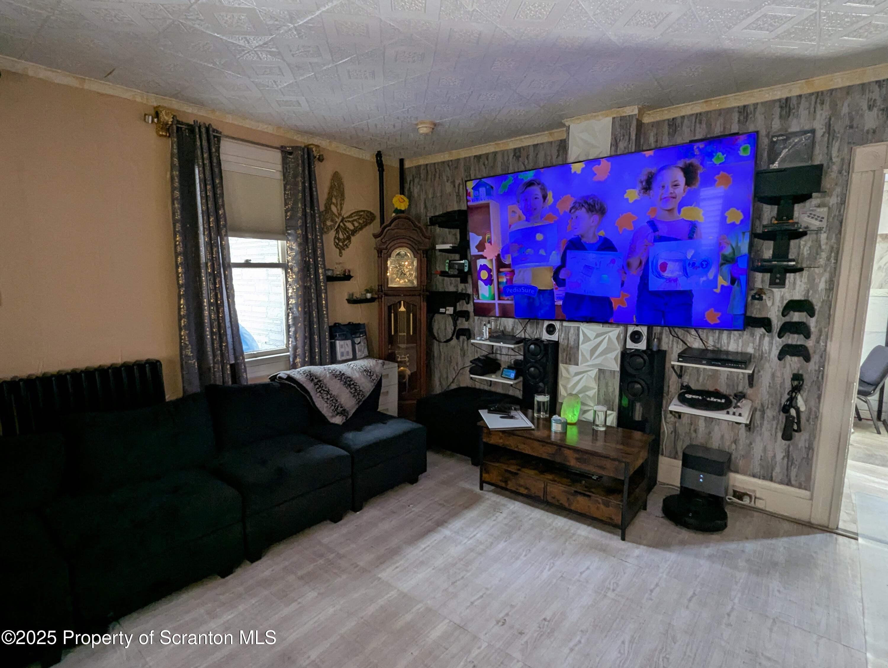 846 Capouse Avenue Scranton, PA 18509 - Photo 14 of 35 a living room with furniture and a bed