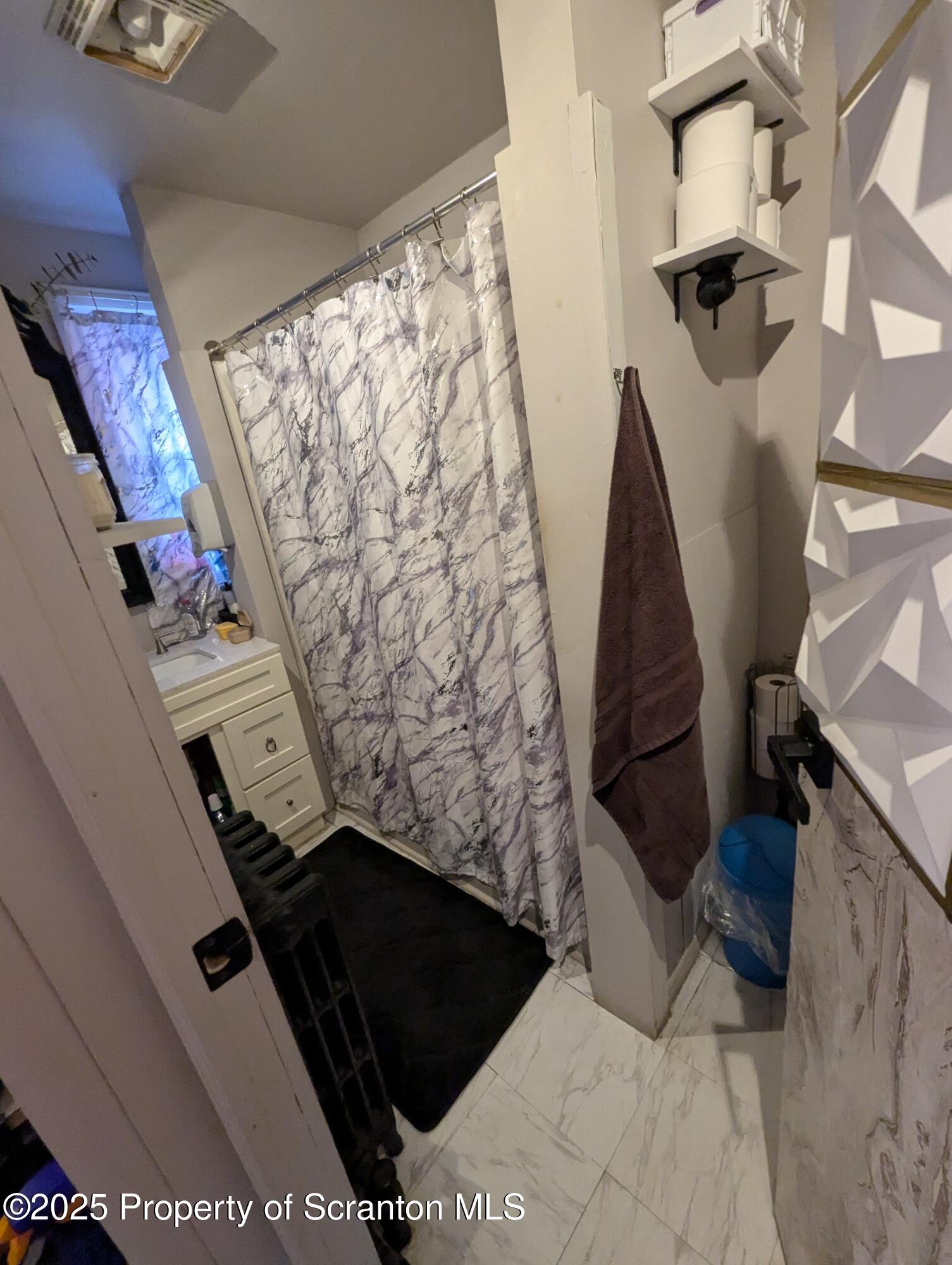 846 Capouse Avenue Scranton, PA 18509 - Photo 2 of 35 a view of walk in closet with clothes and shoes