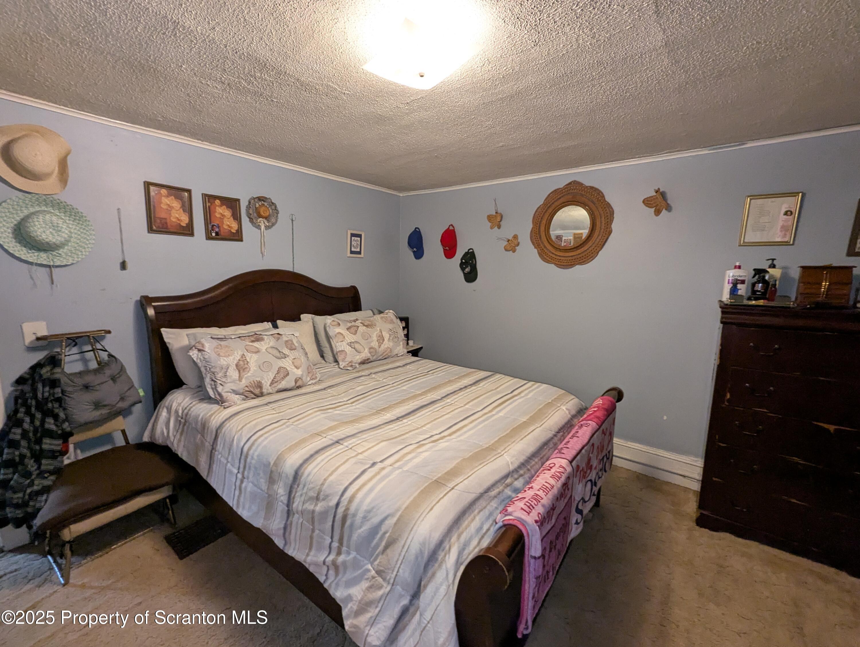 846 Capouse Avenue Scranton, PA 18509 - Photo 28 of 35 a bedroom with a bed and cabinets