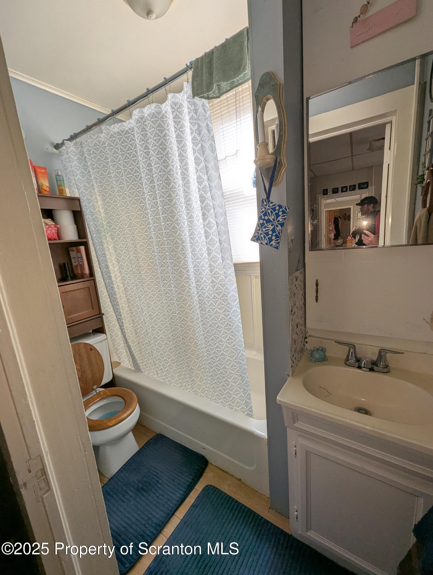 846 Capouse Avenue Scranton, PA 18509 - Photo 30 of 35 a bathroom with a sink a toilet and shower