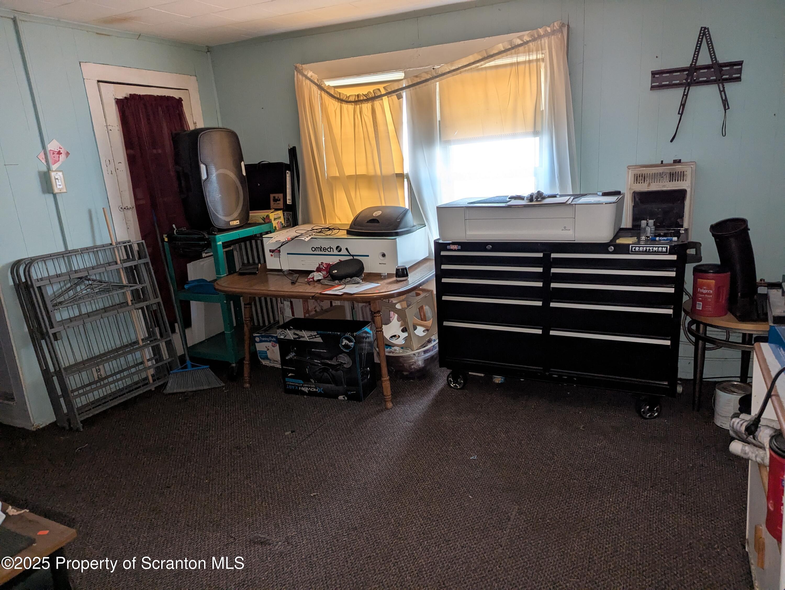 846 Capouse Avenue Scranton, PA 18509 - Photo 10 of 35 a workspace with furniture and a window