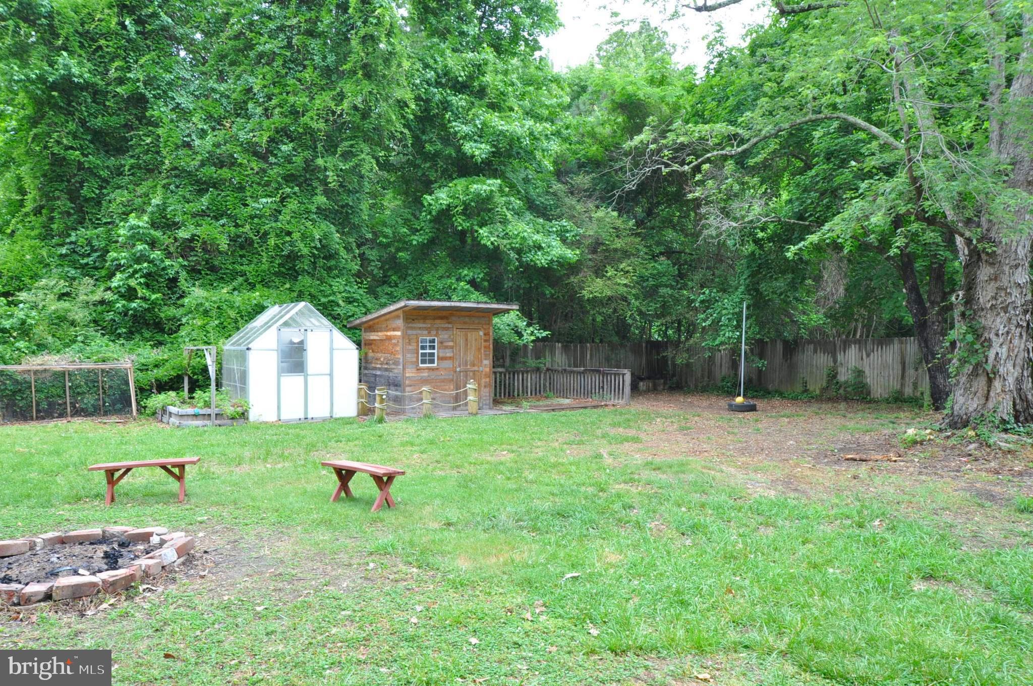 797 Forest Grove Road Colonial Beach, VA 22443 - Photo 27 of 40 Greenhouse and Shed with sitting area