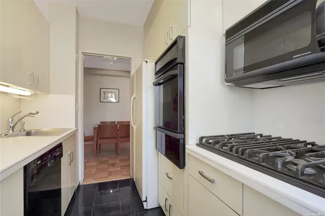 a kitchen with a stove and a microwave