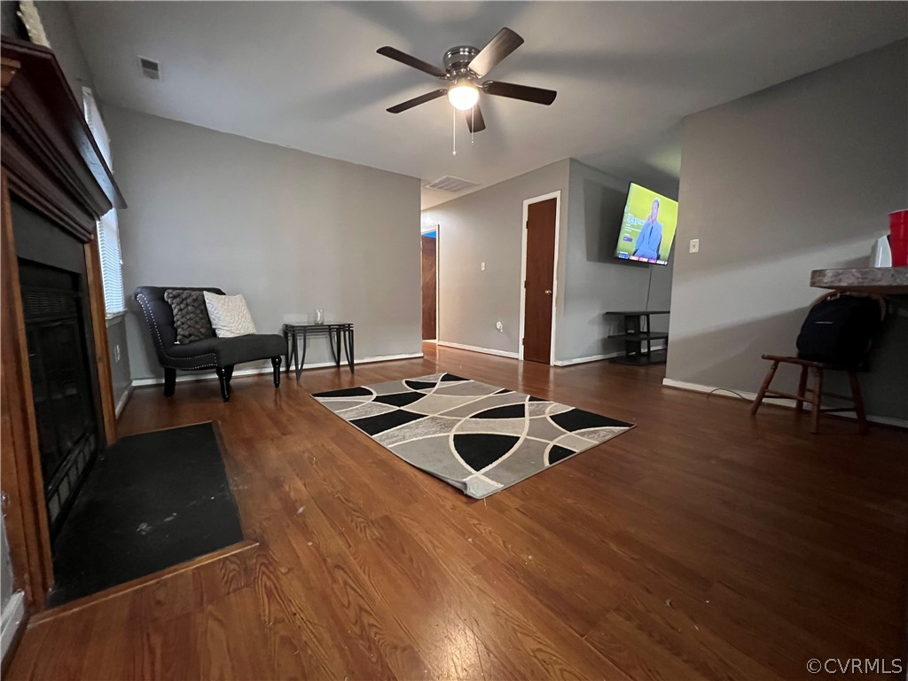 6806 Fairpines Road Chesterfield, VA 23832 - Photo 9 of 12 a living room with furniture and a wooden floor