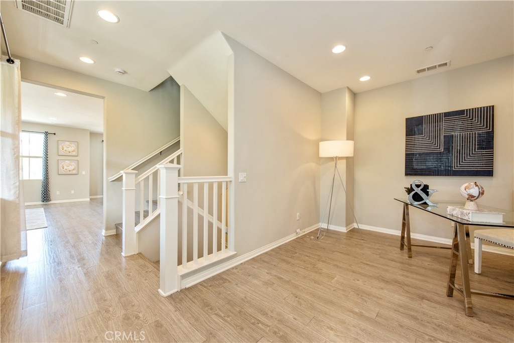 68 Origin Irvine, CA 92618 - Photo 24 of 43 a view of a livingroom with wooden floor and furniture